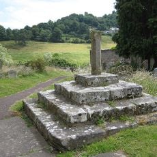 Base of churchyard cross with shaft approximately 2 metres south of south porch of Church of St Giles