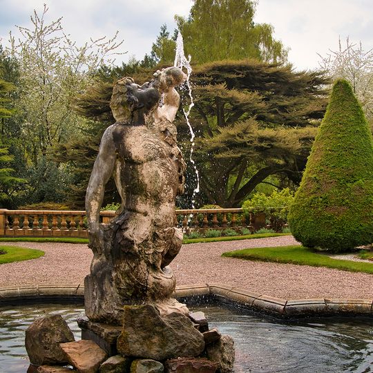 Pool wall and Triton Fountain in lower terrace garden before south front of Tatton Hall