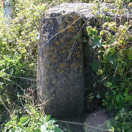 Direction stone at the junction of Foxwell Lane and the A30