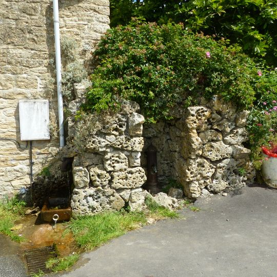 Pump and pump recess circa 10 metres south east of Granny Mabbett's Corner