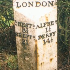 Milepost, roadside at SK404579