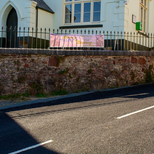 Stone Rubble Retaining Wall And Railings In Front Of The Community Centre And Museum