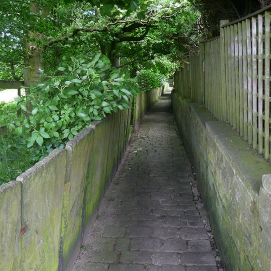 Slab wall to north of footpath between Upper Lane and Hall Lane
