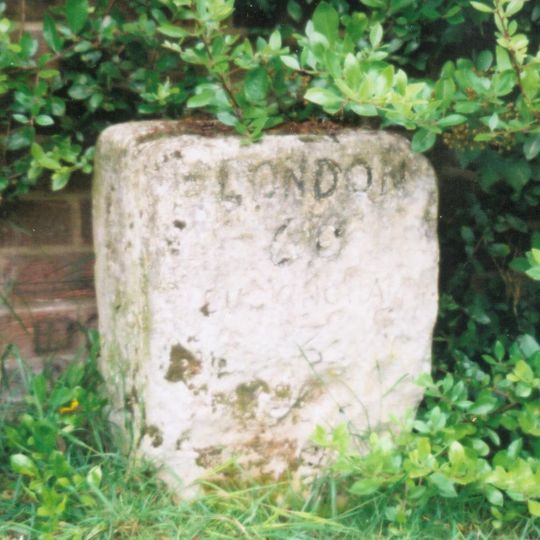 Milestone, Main Street; by The Hollies, W end of village
