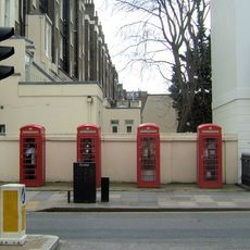 Group Of Four K6 Telephone Kiosks By Garden Wall To Number 1 Warwick Square