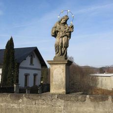 Statue of John of Nepomuk on the stone bridge in Hejnice