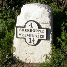 Milestone, W of village, opposite Eagle Mead Goat farm