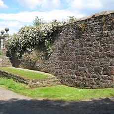 Gate piers, steps and garden wall to west of Huntsham Court