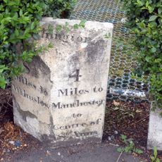 Milestone, Wilmslow Road; by fire station flats, No. 507,