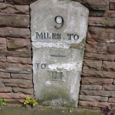 Milestone, front of old police station