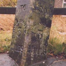 Milestone, by entrance to 866-872 Leeds Road opp Oak Road