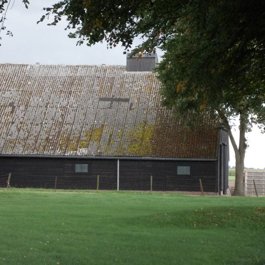 Bijschuur onder wolfsdak