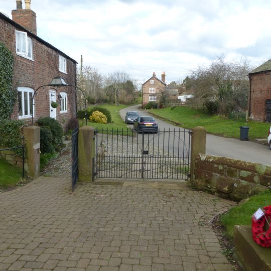 Gates, gatepiers and churchyard wall along north side of Shotwick Lane