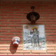 Ceramic panel of Saint Francis of Paola at Mota street