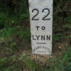 Milestone, 400m W of jct with Mill Rd