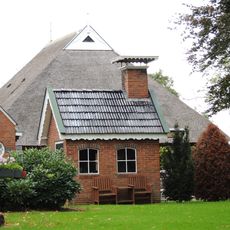 Stookhut onder pannen zadeldak