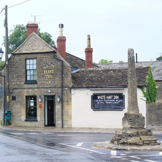 Medieval village cross at the junction of Park Place and the High Road 210m south of Gumstool Bridge