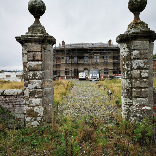 Gate piers and front garden walls to Calveley Hall