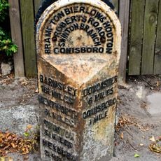 Milepost In Pavement To Front Of Number 10