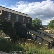 Hydro-electric power house and associated weir 250m north west of Tin Bridge