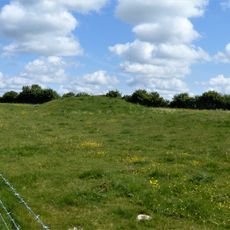 Bowl barrow east of the Ridgeway forming part of the Overton Hill Bronze Age round barrow cemetery.