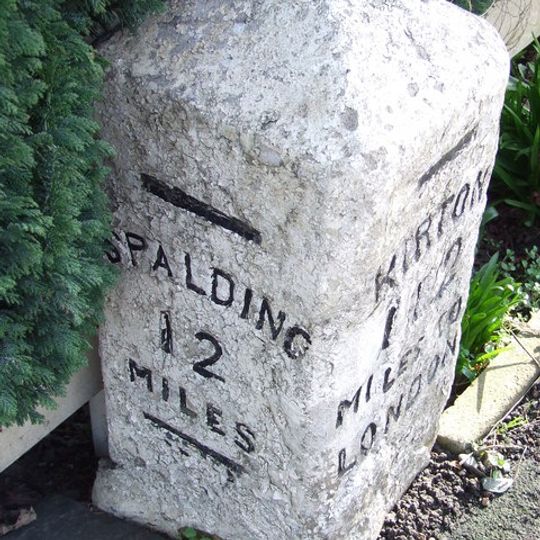 Milestone In Centre Of Village