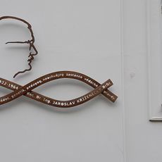 Pamětní deska Jaroslava Kříženeckého na domě Sušilova 774/11 v Brně